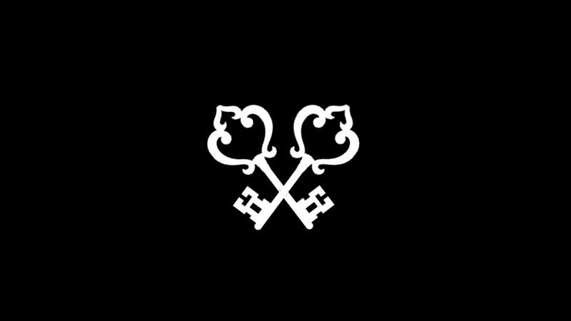 White decorative key symbol on a black background